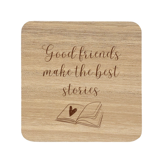Wooden coaster with text 'Good friends make the best stories' and an open book illustration.