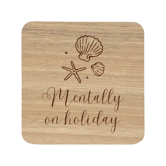 Wooden coaster with shell and starfish designs and 'Mentally on holiday' text.