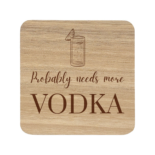 Square wooden coaster with 'Probably needs more VODKA' text and vodka tonic illustration.