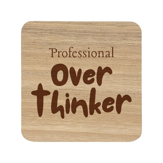 Square wooden coaster with 'professional over thinker' text