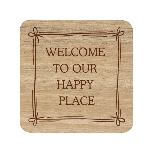 Square wooden coaster featuring the quote "Welcome to our happy place" in crisp lettering with a cute bow border.
