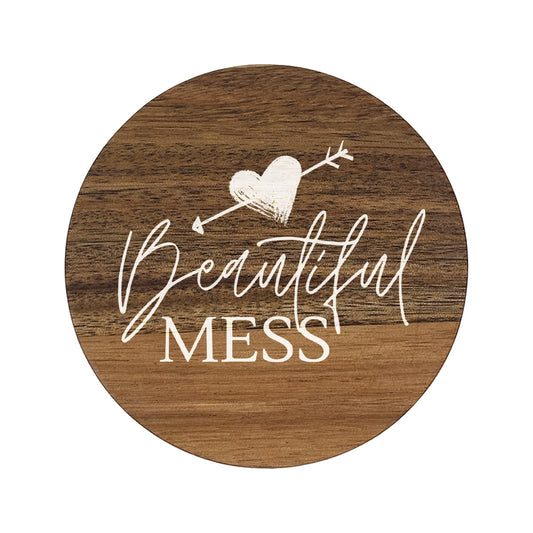 Round wooden coasters with 'Beautiful mess' text in white lettering.