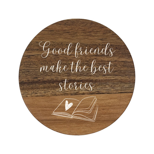 Wooden coaster with 'Good friends make the best stories' text and a heart in a book illustration.