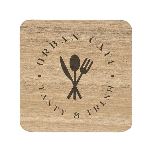 A square wooden coaster with rounded corners, personalised with a dark brown café logo. Your logo here.