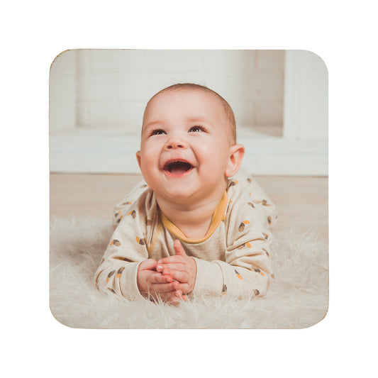Square wooden coaster personalised with a photo of a baby laughing.