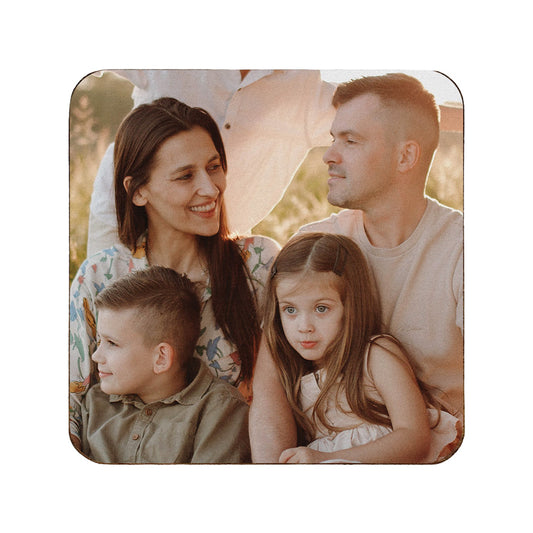 A square wooden coaster personalised with a photo of a family.