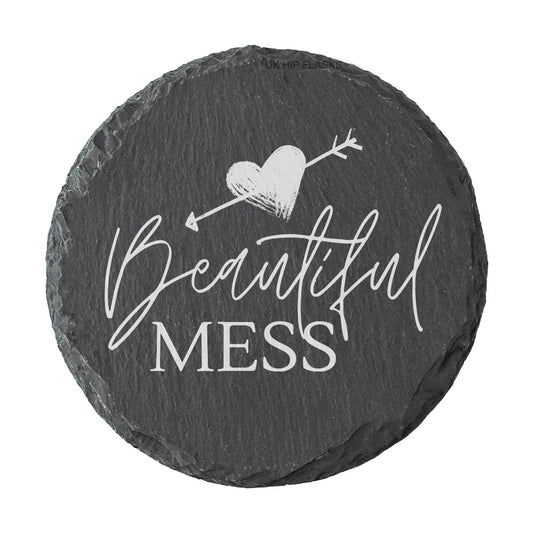 Round slate coaster with 'Beautiful Mess' text and heart design on a white background