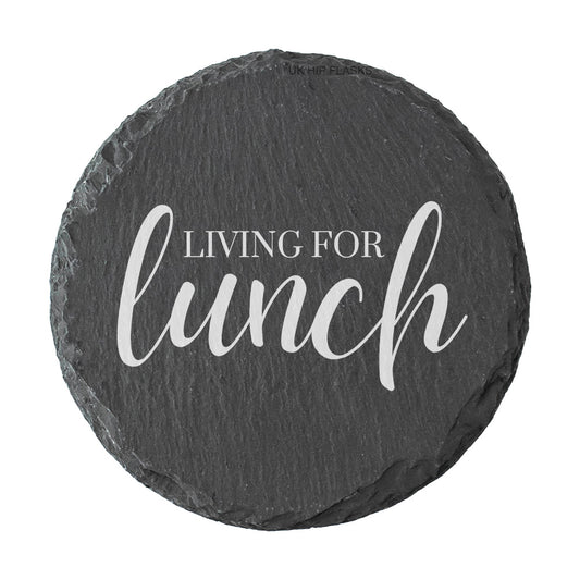 Round slate coaster with 'Living for lunch' text on a white background
