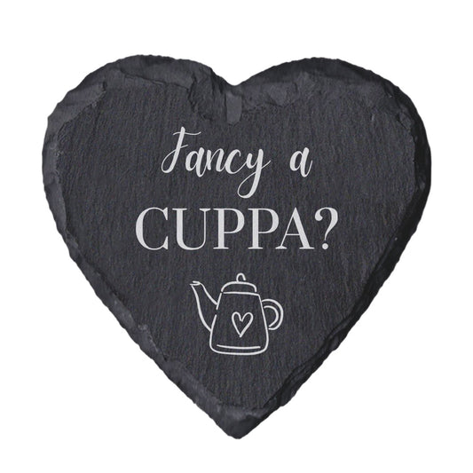 Heart-shaped slate coaster with 'Fancy a Cuppa?' text and teapot illustration on a white background