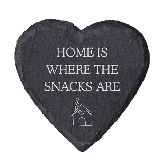 Heart-shaped slate coaster with 'Home is where the snacks are' text on a white background