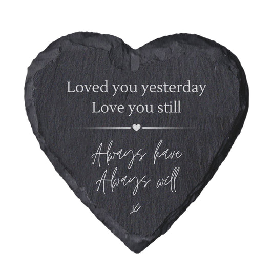 Heart-shaped slate with quote "loved you yesterday love you still always have always will" on a white background