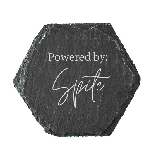 Hexagonal black slate coaster with 'Powered by Spite' text on a white background