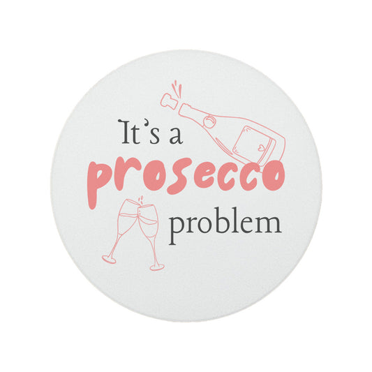 Round ceramic coaster featuring the humorous quote "It's a prosecco problem" in crisp pink lettering.