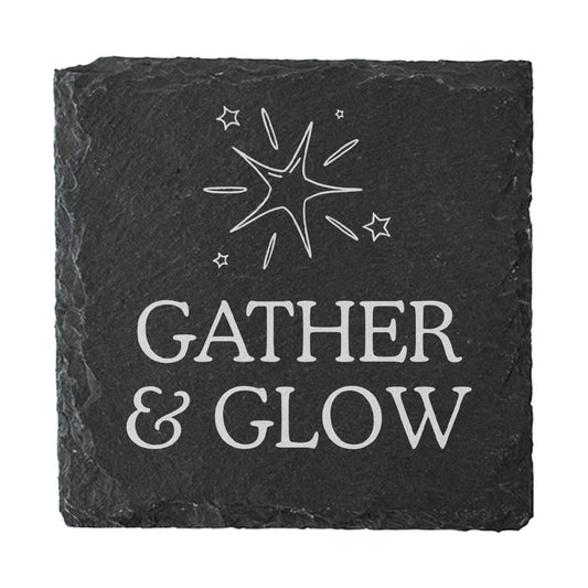 Black slate coaster with 'Gather & Glow' text and star design on a white background