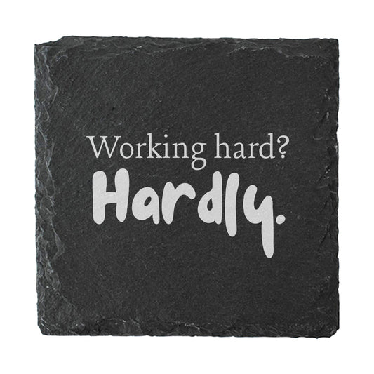 Slate coaster with funny quote "Working hard? Hardly." in white text.