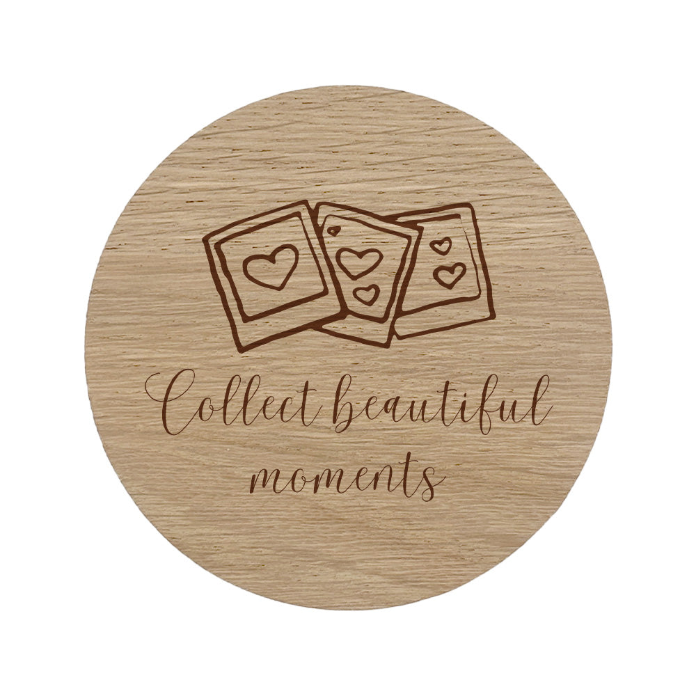 Round wooden coaster with photo design and text 'Collect beautiful moments' on a white background