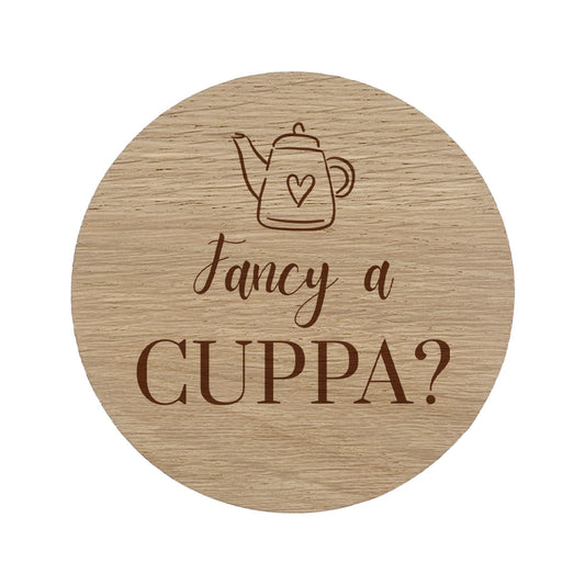 Wooden coaster with 'Fancy a Cuppa?' text and teapot illustration on a white background