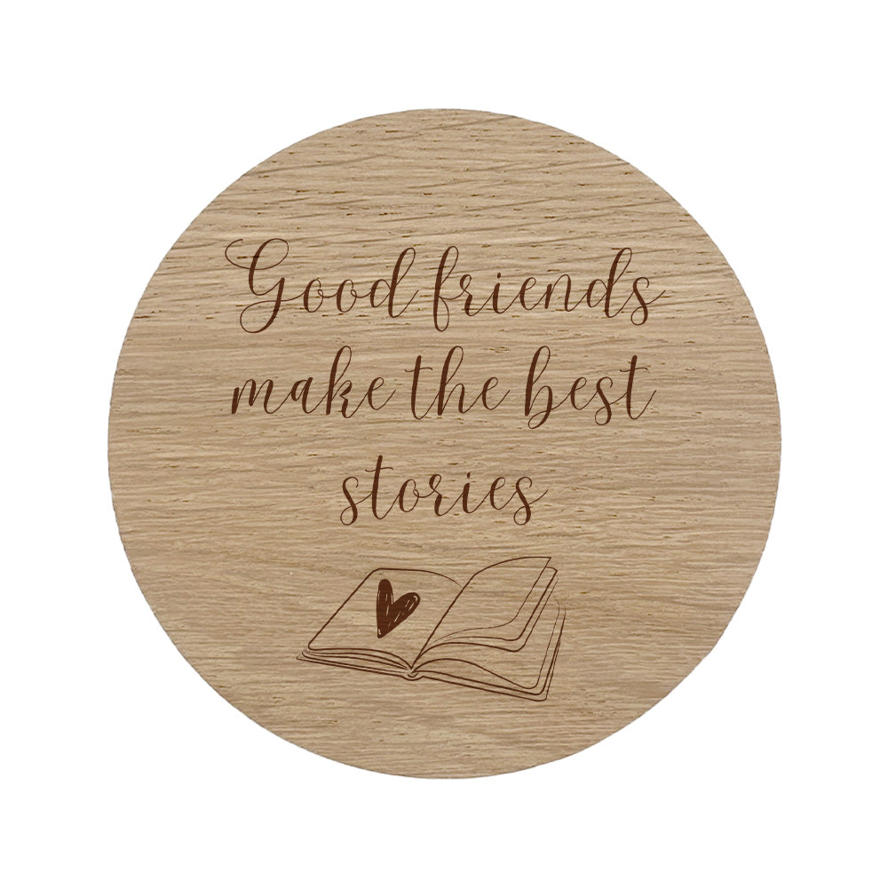 Wooden coaster with 'Good friends make the best stories' text and a book illustration.
