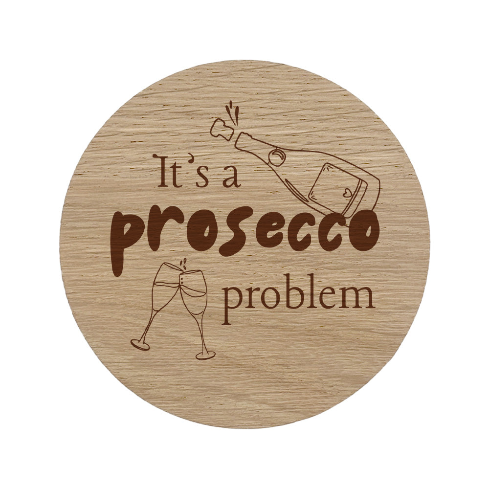 Round wooden coaster with "it's a prosecco problem" text.