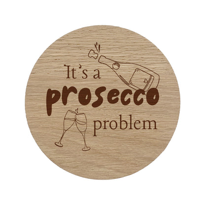 Round wooden coaster with "it's a prosecco problem" text.