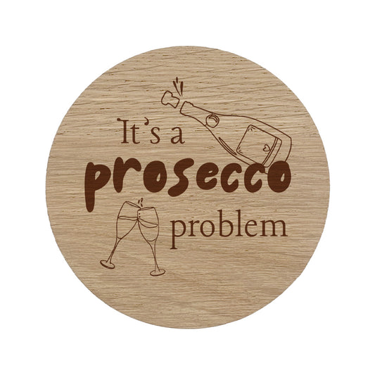 Round wooden coaster with "it's a prosecco problem" text.