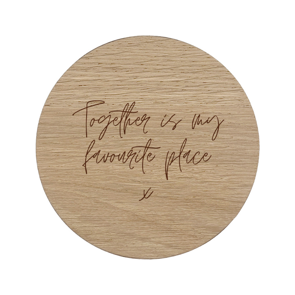 Round wooden coaster with text 'Together is my favourite place' on a white background