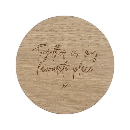 Round wooden coaster with text 'Together is my favourite place' on a white background