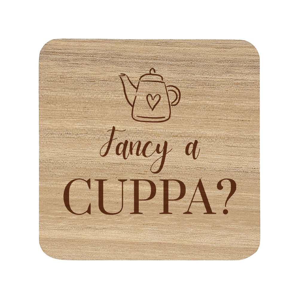 Wooden coaster with teapot illustration and 'Fancy a Cuppa?' text on a white background