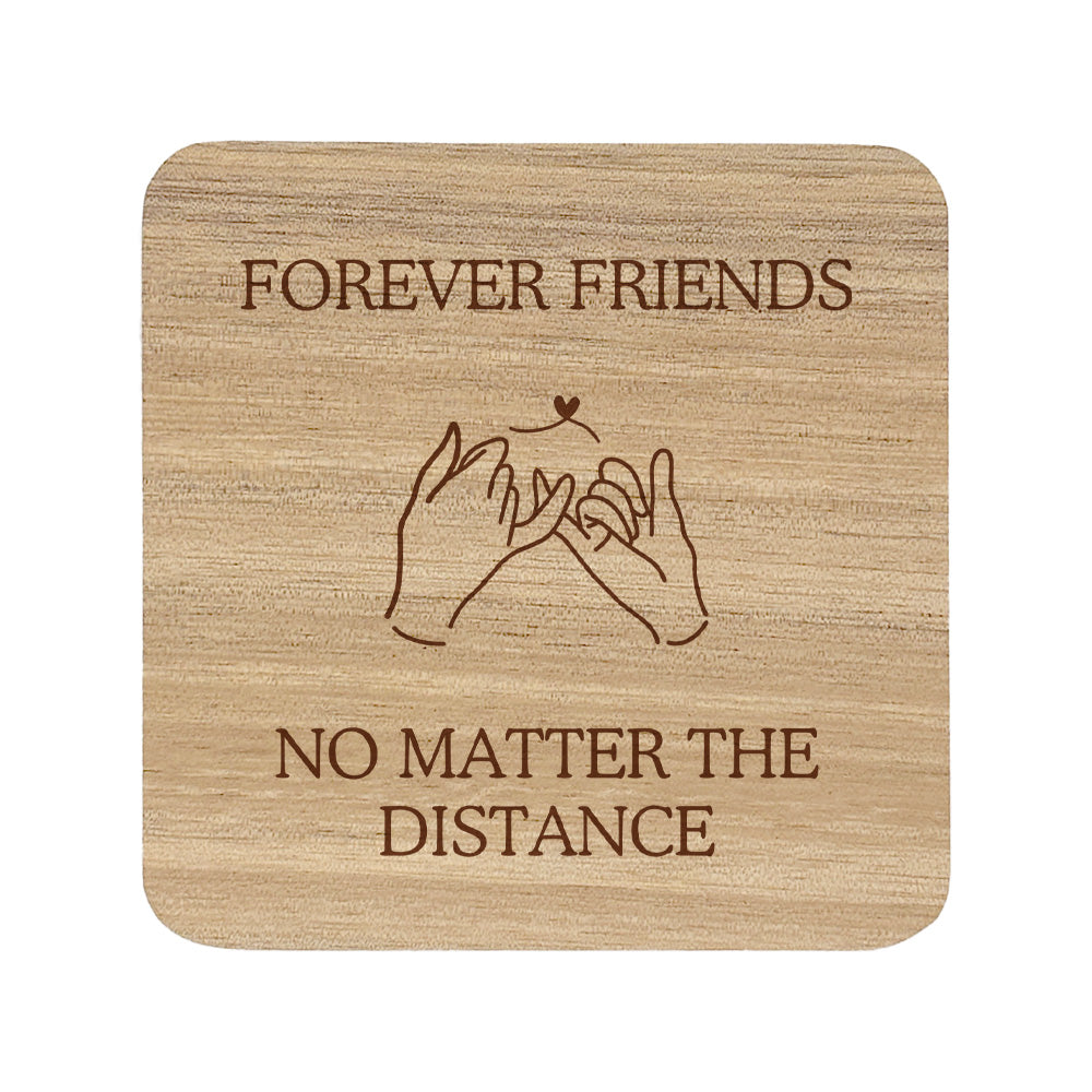 Wooden coaster with text 'Forever Friends No Matter The Distance' on a white background