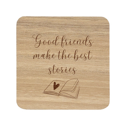 Wooden coaster with text 'Good friends make the best stories' and an open book illustration.