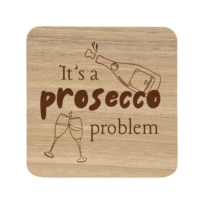 Square wooden coaster with text "it's prosecco problem" and illustrated prosecco glass and bottle.
