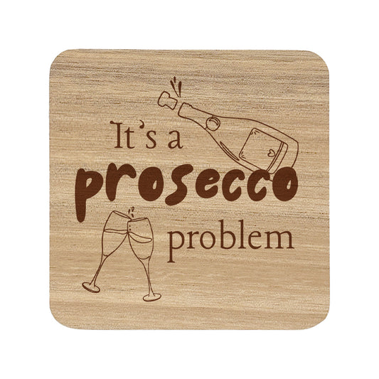 Square wooden coaster with text "it's prosecco problem" and illustrated prosecco glass and bottle.