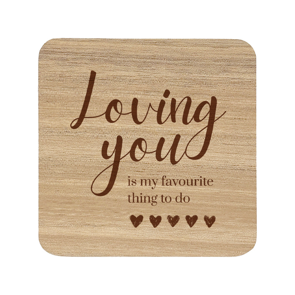 Wooden coaster with text 'Loving you is my favourite thing to do' on a white background