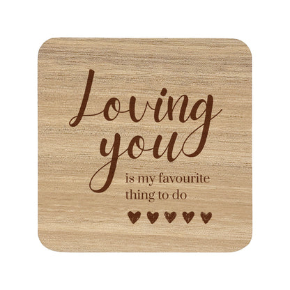 Wooden coaster with text 'Loving you is my favourite thing to do' on a white background