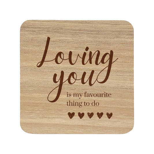 Wooden coaster with text 'Loving you is my favourite thing to do' on a white background