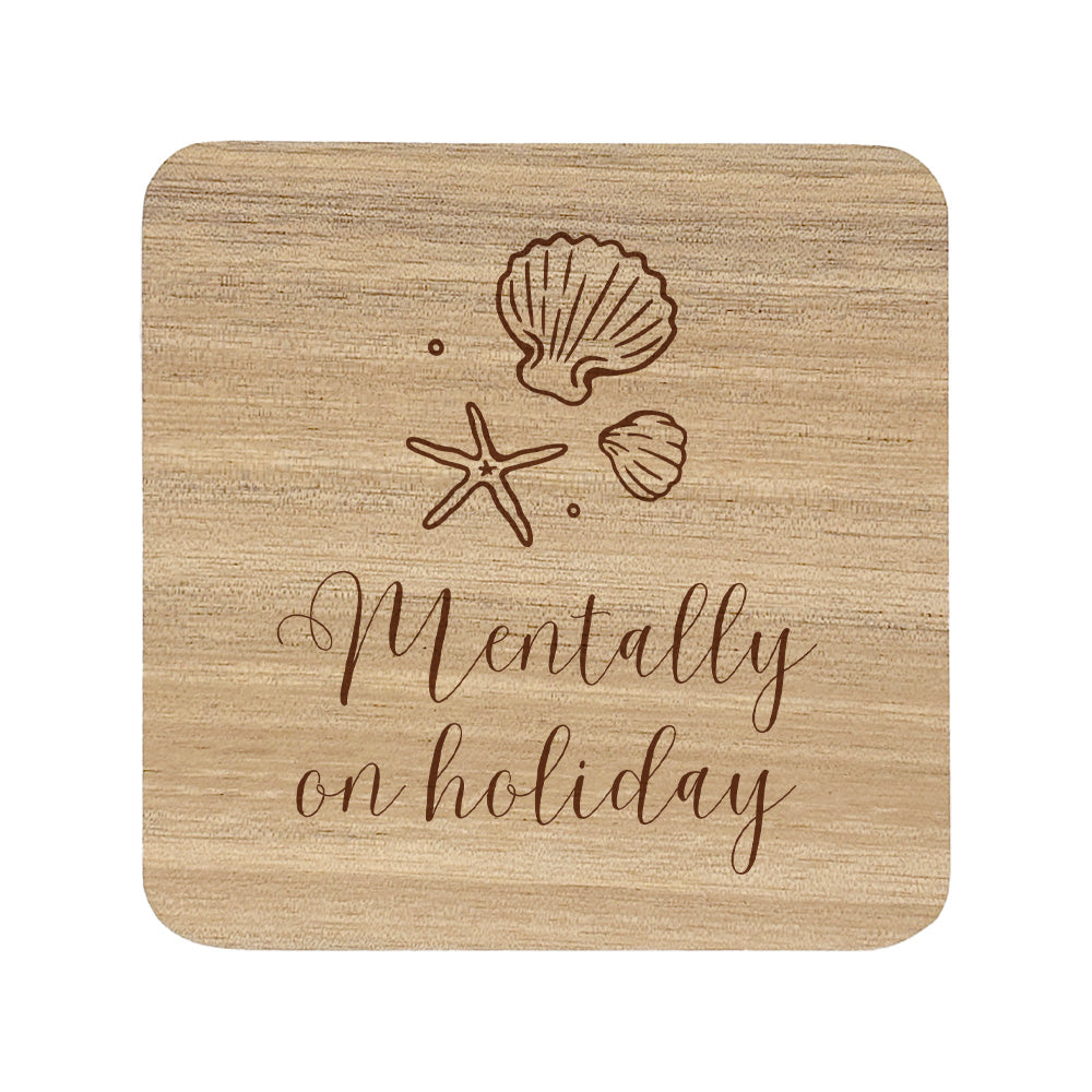 Wooden coaster with shell and starfish designs and 'Mentally on holiday' text.