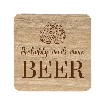 Square wooden coaster with "probably needs more beer" text and beer glasses illustration