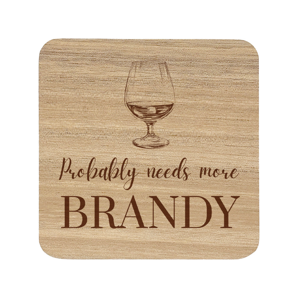 Square wooden coaster with "probably needs more brandy" text and brandy glass illustration