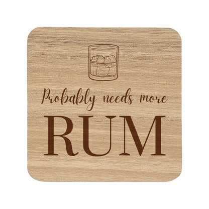 Square wooden coaster featuring the funny quote "Probably needs more rum" in crisp lettering with a rum glass illustration.