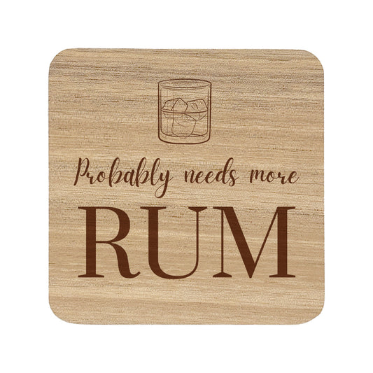 Square wooden coaster featuring the funny quote "Probably needs more rum" in crisp lettering with a rum glass illustration.