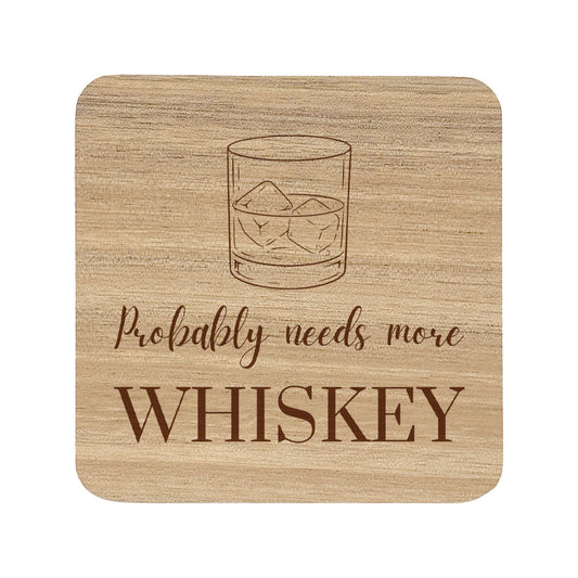 Square wooden coaster with 'Probably needs more whiskey' text and whiskey glass illustration.