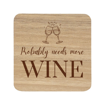 Square wooden coaster with 'Probably needs more wine' text and wine glass illustration.
