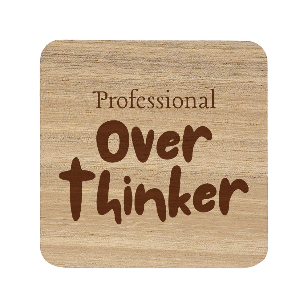 Square wooden coaster with 'professional over thinker' text