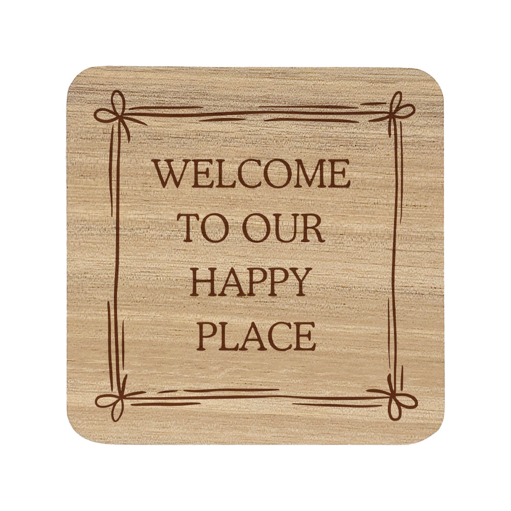 Square wooden coaster featuring the quote "Welcome to our happy place" in crisp lettering with a cute bow border.