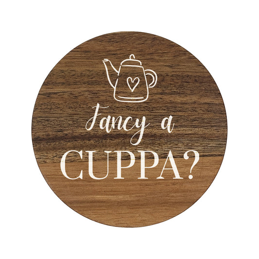 Round wooden coaster with 'fancy a cuppa?' white text and teapot illustration.