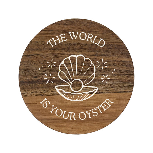 Round wooden coaster with 'The World Is Your Oyster' text and shell illustration on a white background