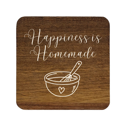 Square wooden coaster with 'Happiness is Homemade' text and a bowl and whisk illustration.