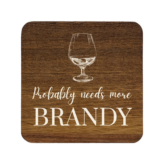 Square wooden coaster with the funny quote "Probably needs more brandy" and a brandy glass illustration.