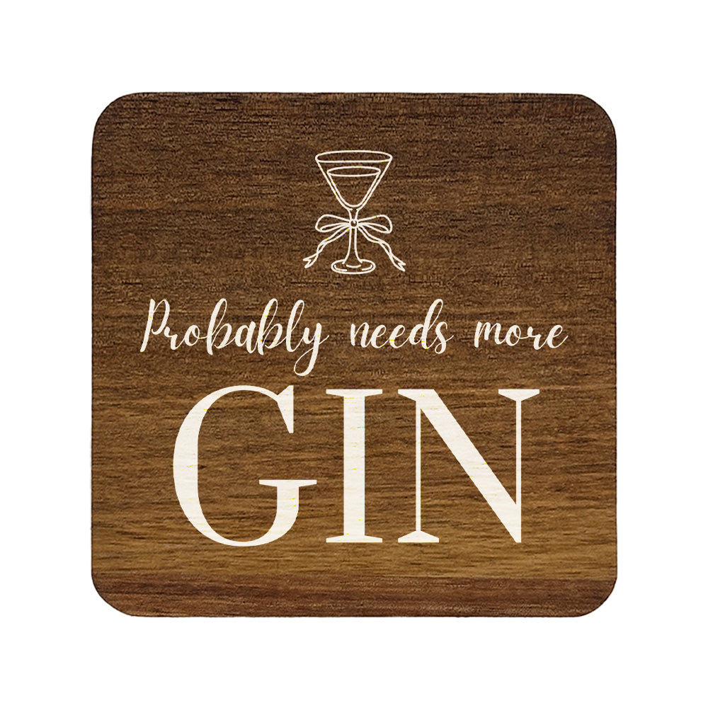 Square wooden coaster with 'probably needs more gin' quote in white text with a gin glass illustration.