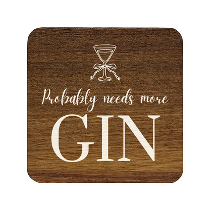 Square wooden coaster with 'probably needs more gin' quote in white text with a gin glass illustration.